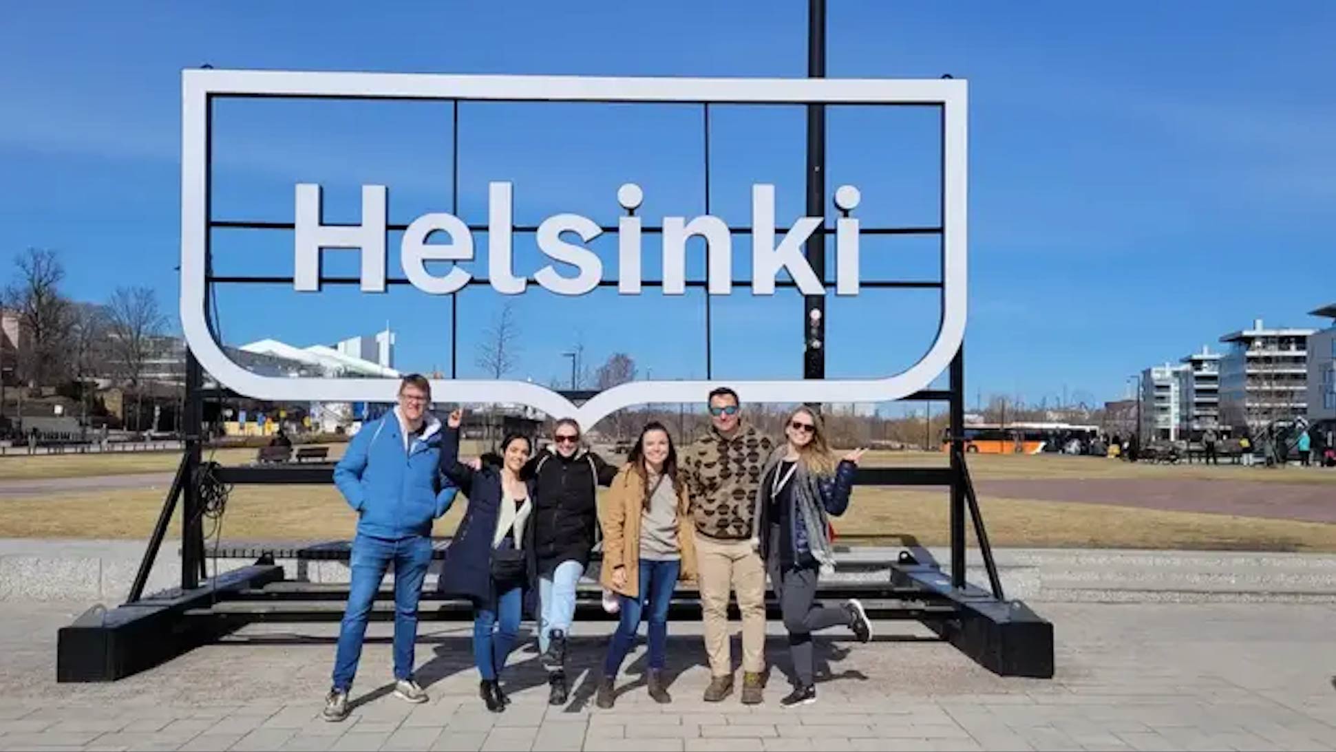 Group at the Helsinki sign